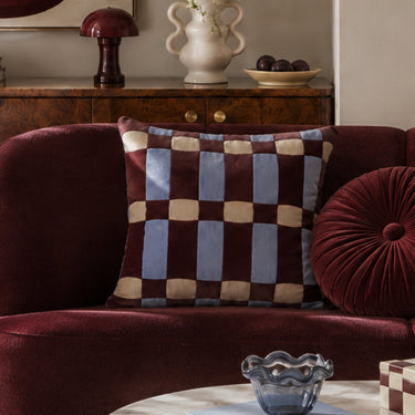Brownie Tile cushion on a sofa