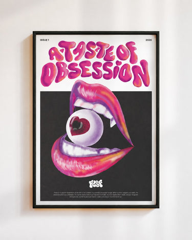 A Taste of Obsession poster in a black frame on a white wall: glossy pink lips biting an eyeball with a heart shaped pupil, under the words A Taste of Obsession