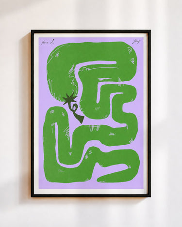 Felfela poster in green, in a black frame on a white wall: a green chilli pepper looping into a maze on lilac