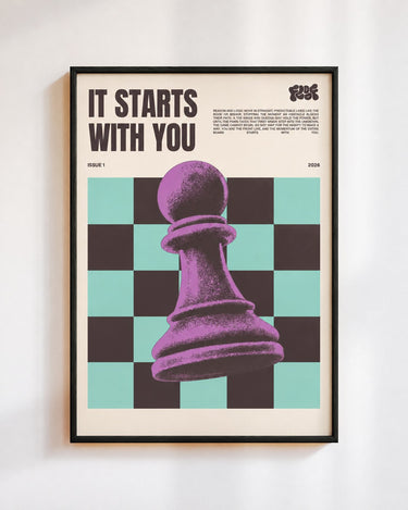 It Starts With You poster in a black frame on a white wall: a purple chess pawn on mint and black squares, under the words It Starts With You