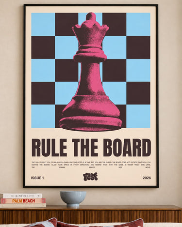 Rule the Board poster framed above a wooden sideboard