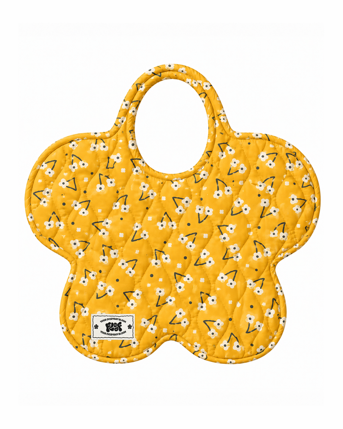 Daisy Patch Bag, a quilted flower-shaped tote in butter yellow with white daisies