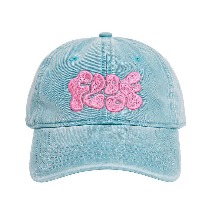 Faded aqua cap with the Floof wordmark in pink puff embroidery