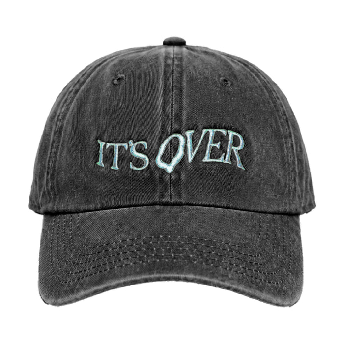 Washed black cap with IT'S OVER embroidered on the front in pale blue outlined lettering