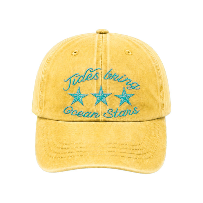 Butter yellow cap with Tides bring ocean stars in teal script above three teal starfish