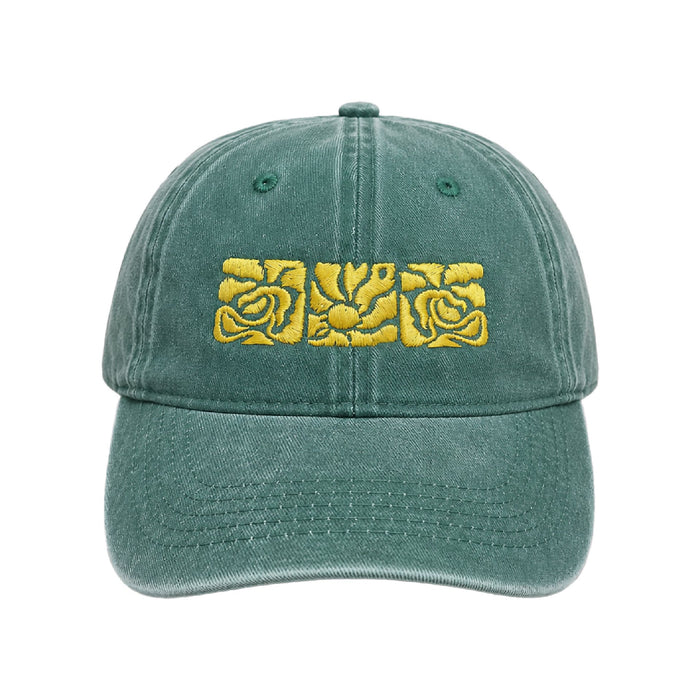 Washed sage green cap with three gold embroidered rose tiles across the front