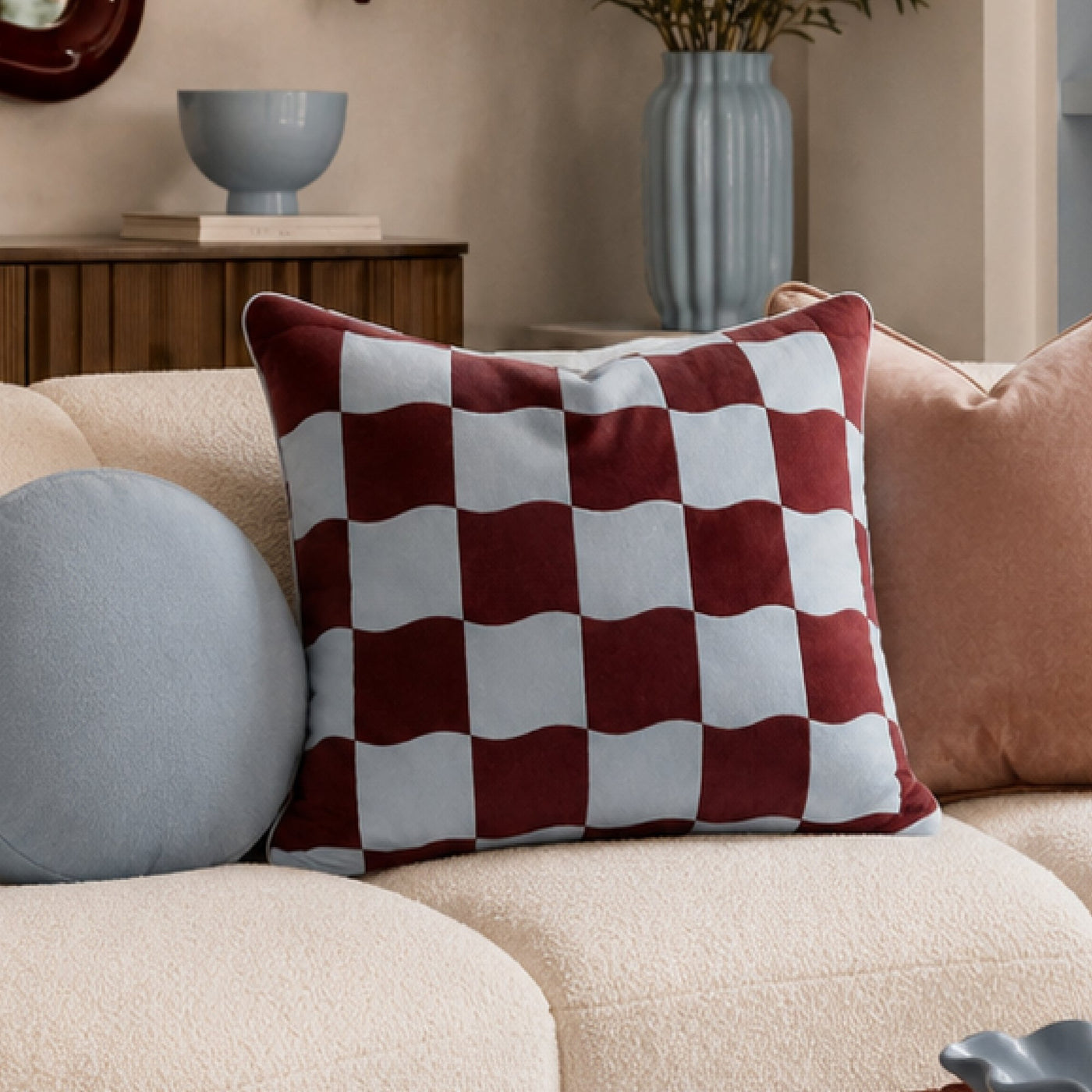 Brownie Check cushion on a cream sofa