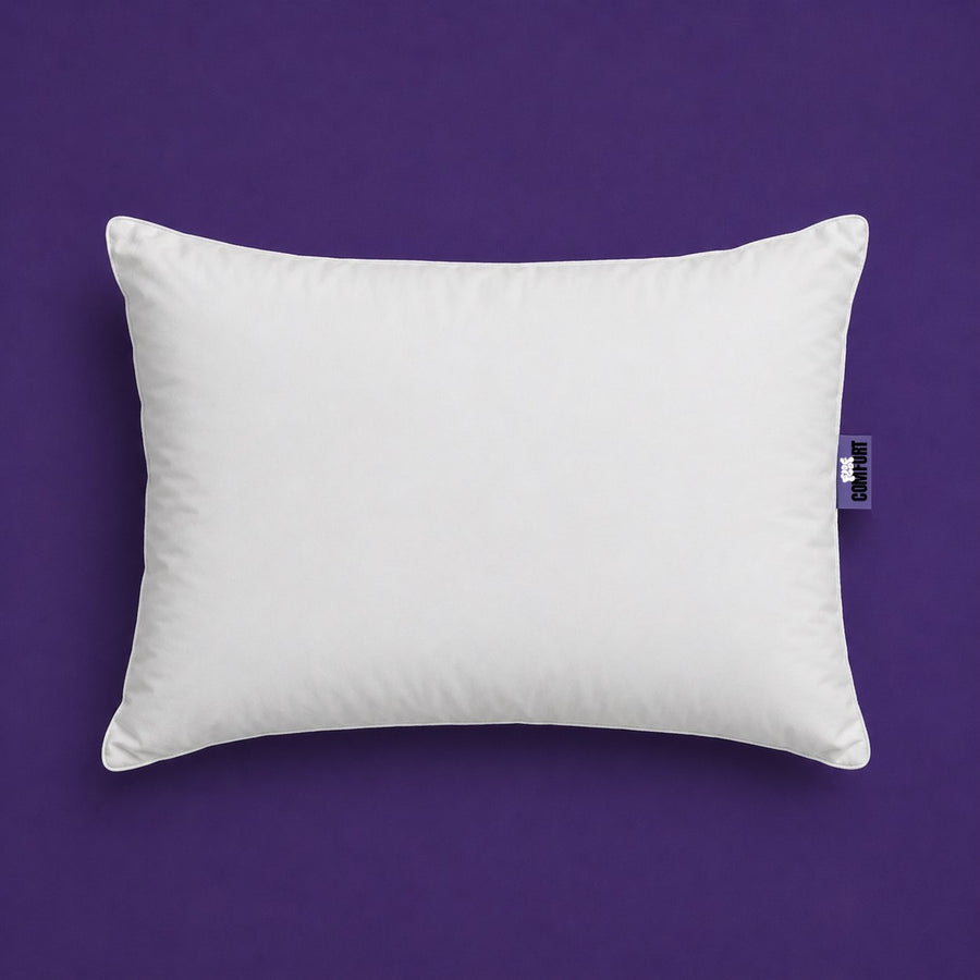 Comfort Hotel Pillow, a white piped sleeping pillow on a purple background