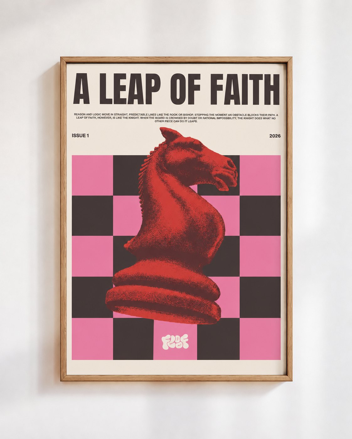 A Leap of Faith poster in a wooden frame on a white wall: a red chess knight on pink and black squares, under the words A Leap of Faith