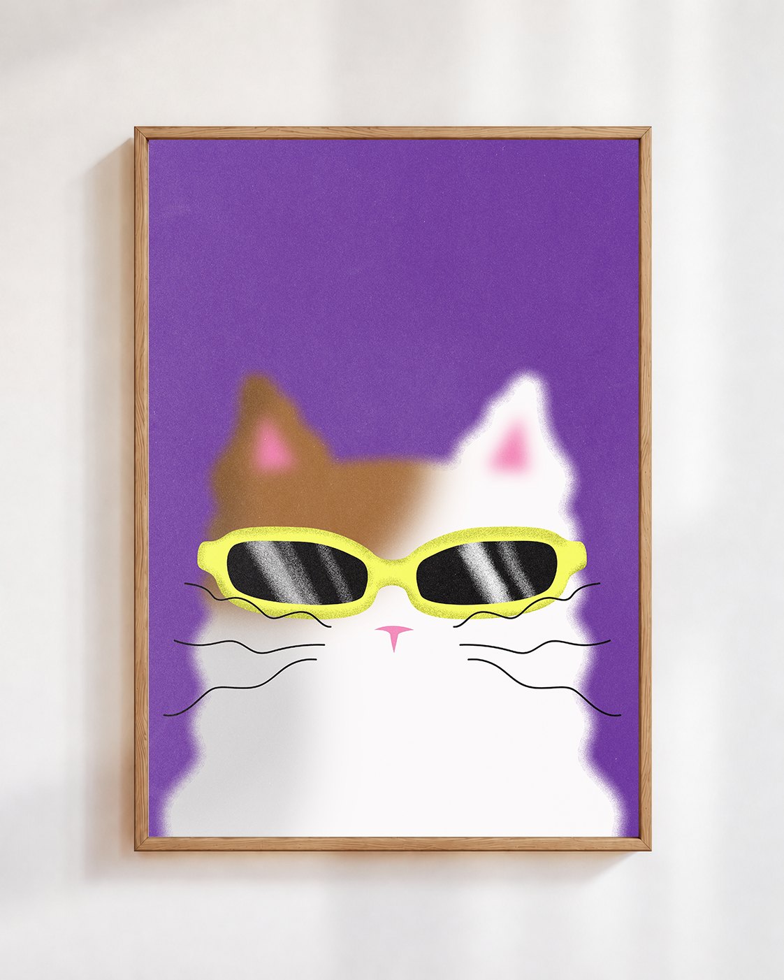 Cool Cat poster in a wooden frame on a white wall: a calico cat in yellow sunglasses on a violet background