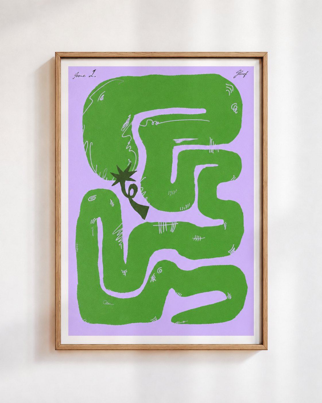 Felfela poster in green, in a wooden frame on a white wall: a green chilli pepper looping into a maze on lilac