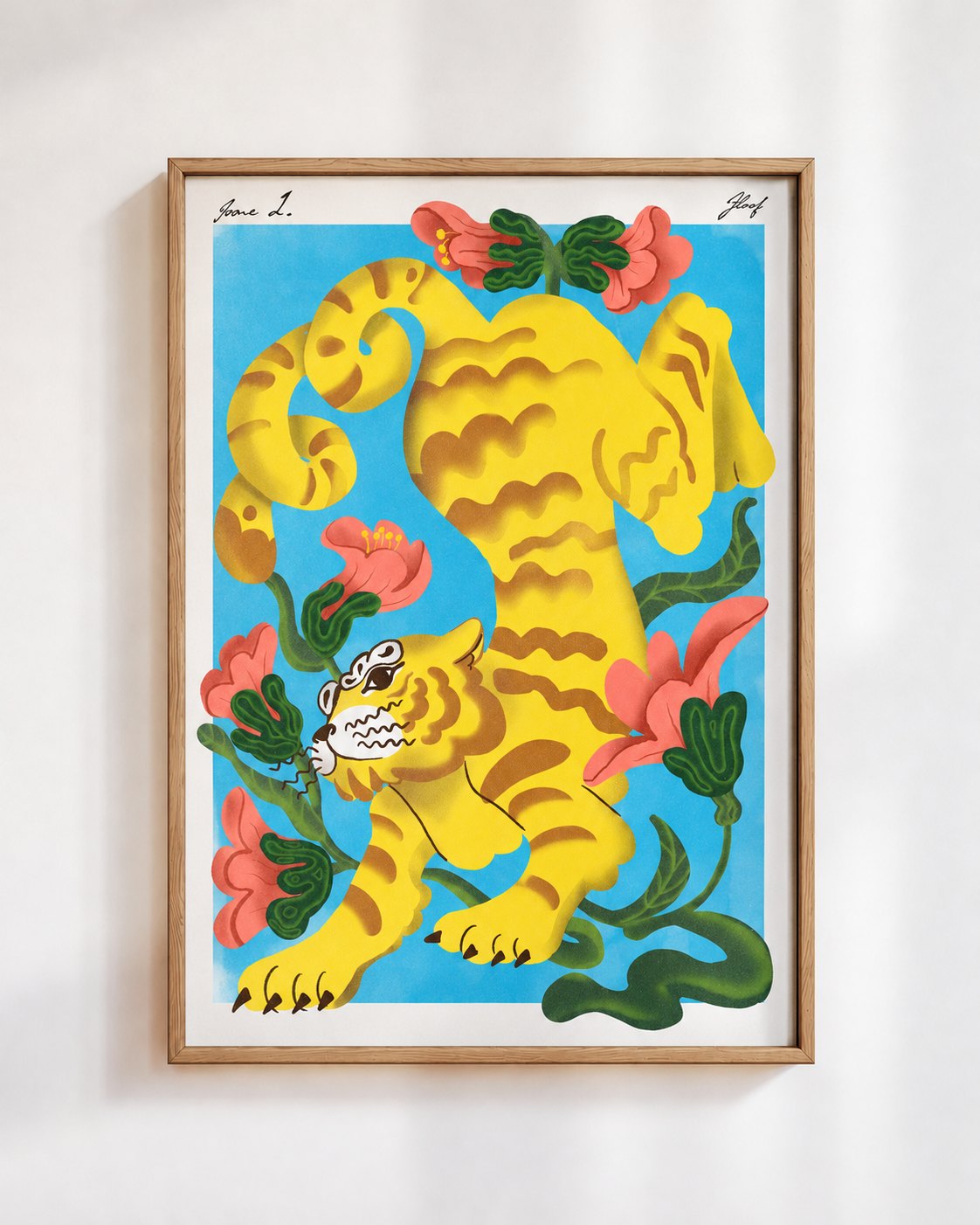 Garden Tiger poster in blue, in a wooden frame on a white wall: a yellow striped tiger among coral flowers on a sky blue background